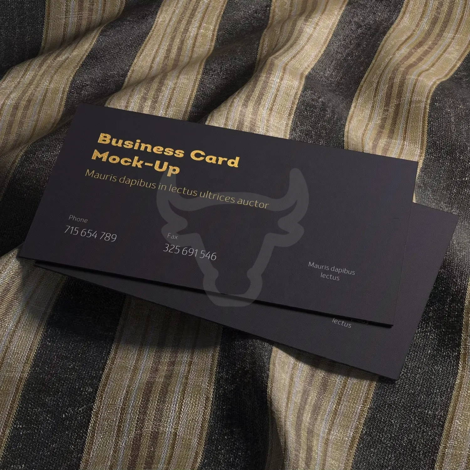 Soft matte business card held against a textured background.