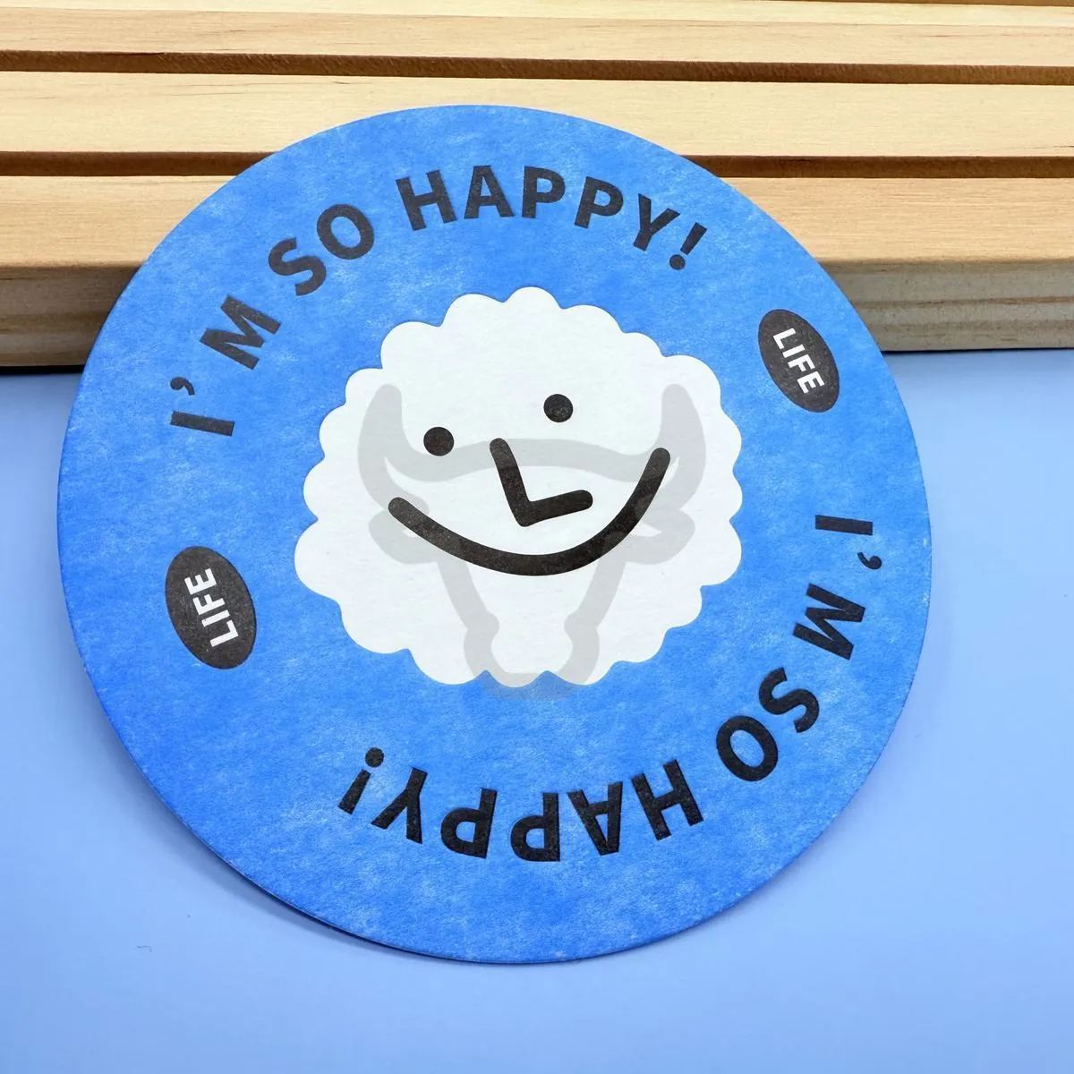 Custom printed coasters arranged for an event.