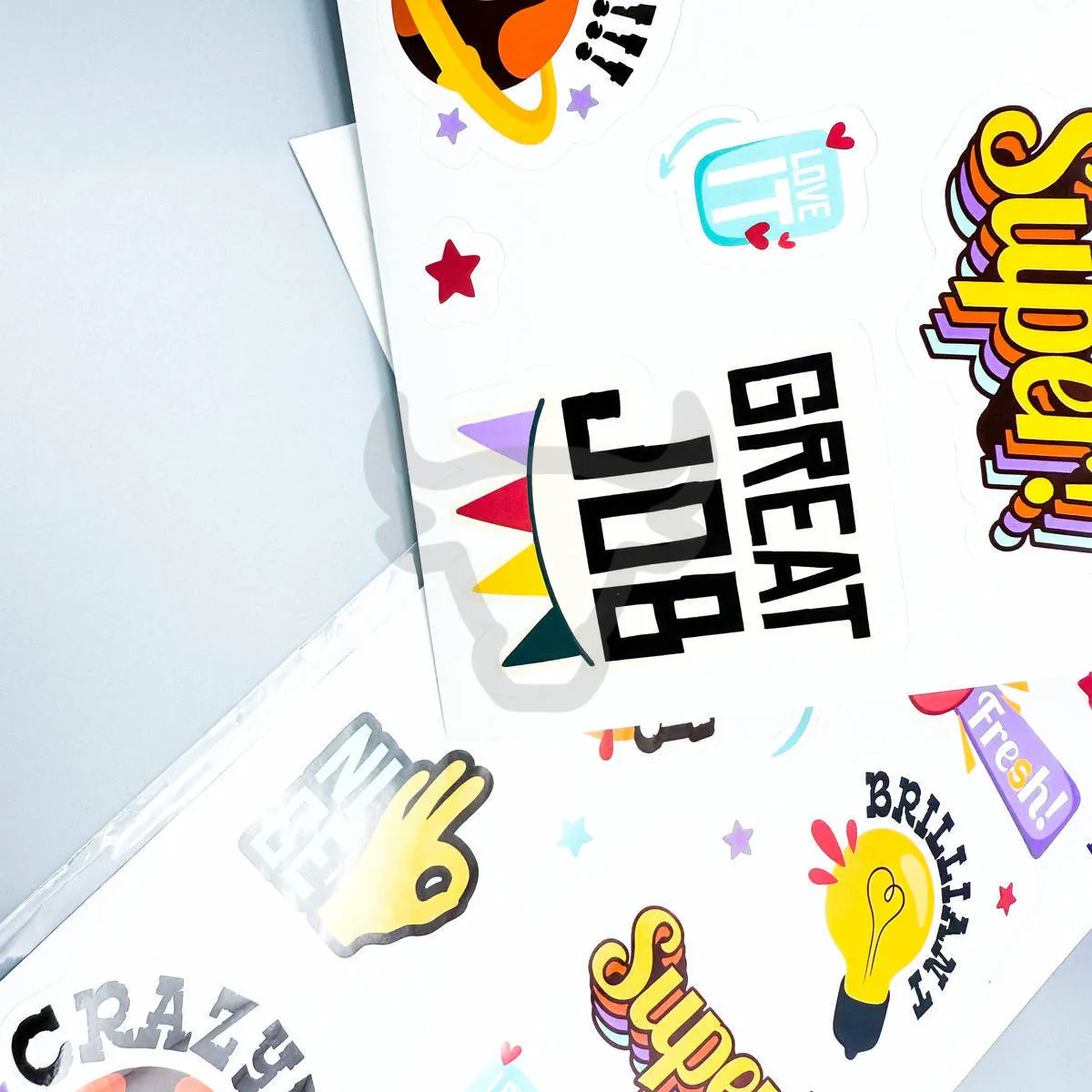Contour-cut sticker shapes on a printed sheet.