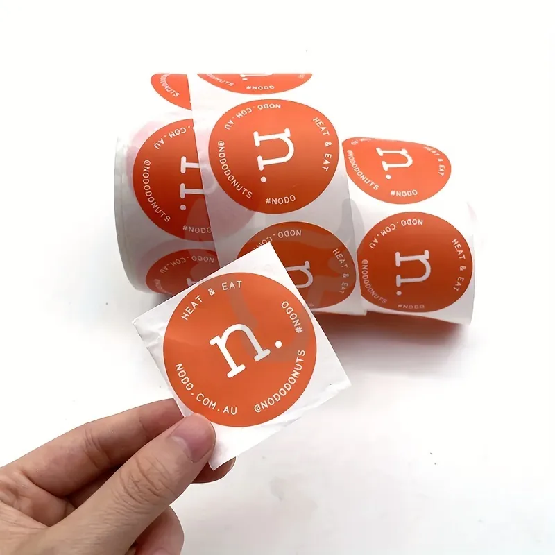 Roll of custom labels wound on a 76mm core.